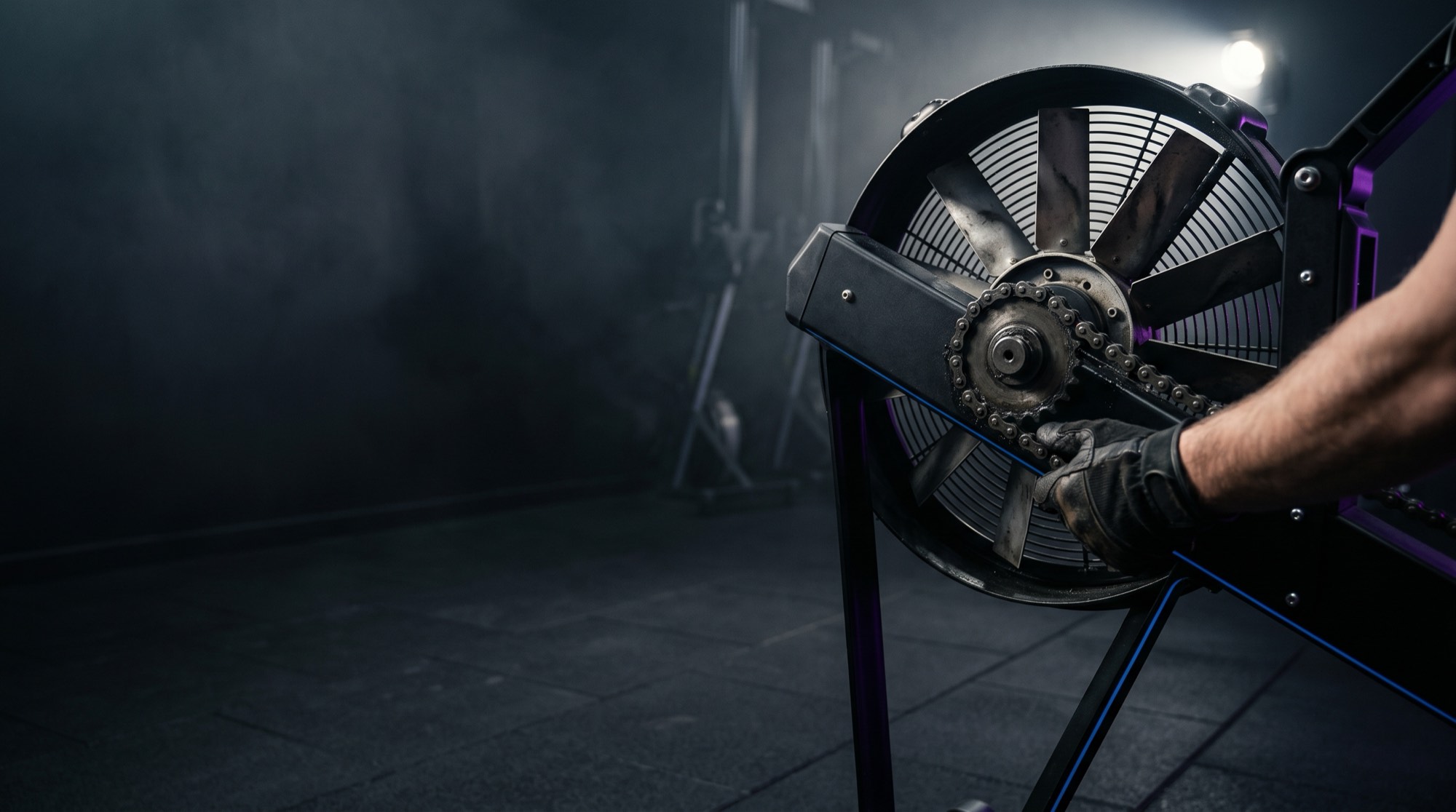 Air-resistance ergometer flywheel and chain